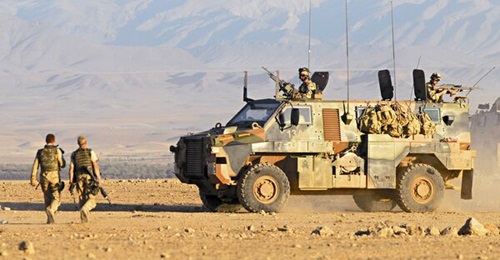 An ADF Bushmaster (pictured above) provides protection as part of an Australian reconstruction task force convoy in southern Afghanistan.