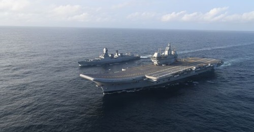 The future INS 
        
        , seen here with the first-of-class Kolkata-class destroyer.