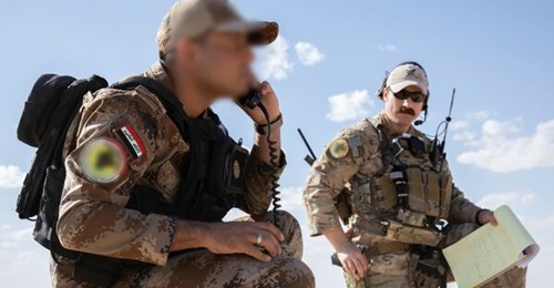 An ITAC (left) practises calling an airstrike during training near Iraq's Al-Asad Airbase during Exercise 'Phoenix Fires' in October 2021.