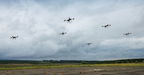A UAS swarm comprising of Malloy Aeronautics TRV150 systems during a Royal Marines trial.