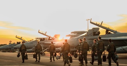 Aircrew from the RAAF's No 1 and No 6 Squadron walk towards their aircraft at RAAF Base Darwin. Australia has upgraded its training to maintain the “air combat capability edge” of its F/A-18F and E/A-18G Growler pilots and personnel.