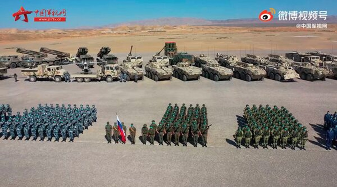 A screengrab from footage released by CCTV on 9 August showing Russian and Chinese troops, along with related equipment, during a ceremony held that day at the Qingtongxia combat training base in China's Ningxia Hui Autonomous Region to mark the start ...