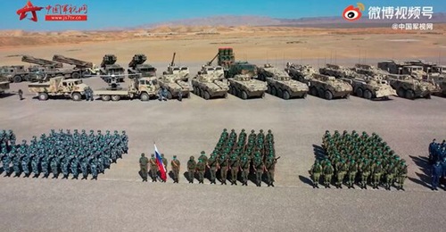 A screengrab from footage released by CCTV on 9 August showing Russian and Chinese troops, along with related equipment, during a ceremony held that day at the Qingtongxia combat training base in China's Ningxia Hui Autonomous Region to mark the start ...