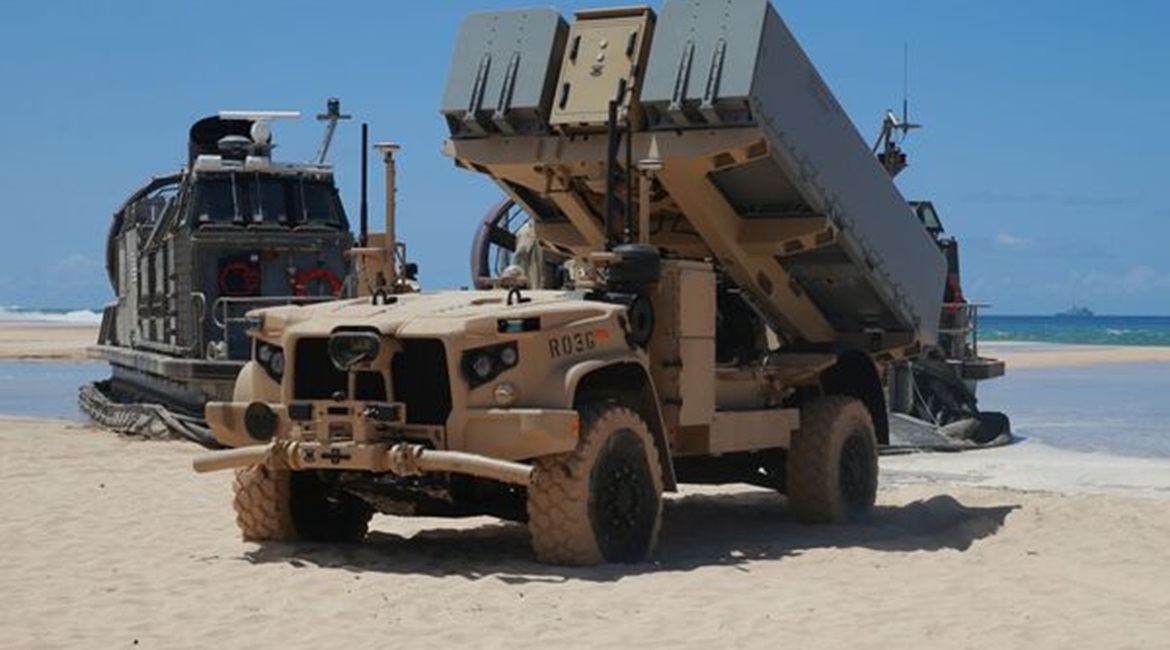 A Navy Marine Expeditionary Ship Interdiction System (NMESIS) launcher deploys into position aboard Pacific Missile Range Facility Barking Sands, Hawaii, on 16 August. The NMESIS and its Naval Strike Missiles participated in a live-fire exercise during...
