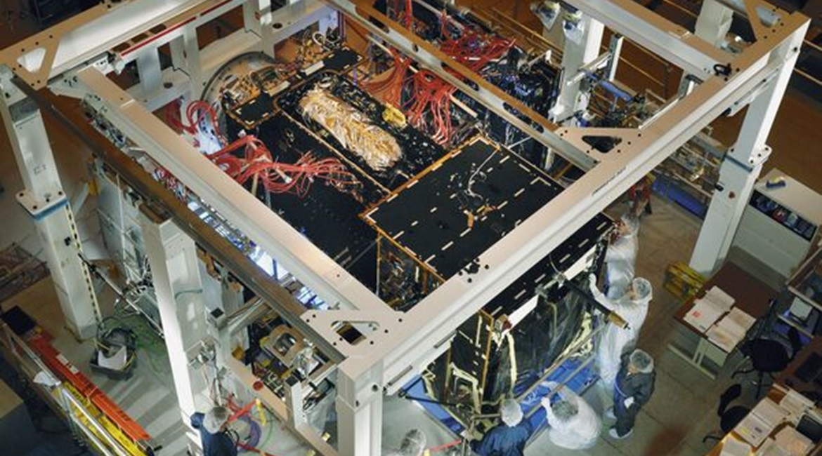 Programme officials prepare a SBIRS GEO-2  spacecraft for baseline integration.