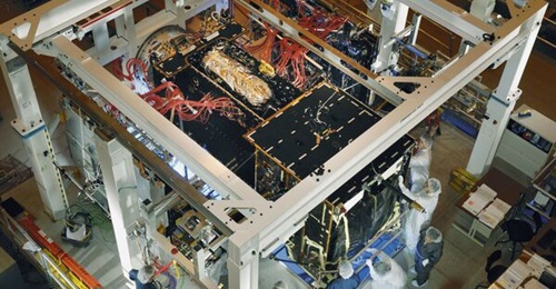 Programme officials prepare a SBIRS GEO-2  spacecraft for baseline integration.