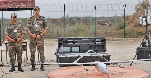 Moroccan personnel stand next to a BlueBird WanderB-VTOL UAV during Exercise 'Maroc Mantlet 2022' at the Kenitra airbase.