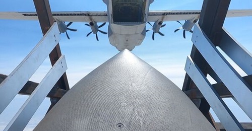 An airdropped Palletized Munition Deployment System carrying JASSM-ER simulants. The image shows one of the AGM-158B JASSM-ER cruise missiles in the Deployment Box immediately after being airdropped from a 193rd Special Operations Wing EC-130J Commando...