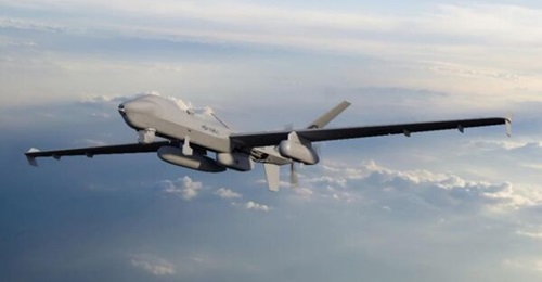 An artist's rendering showing an MQ-9A Block 5-25 in VMU-1 colours. The SkyTower ANE pod is carried beneath the MQ-9A's left wing stores station.