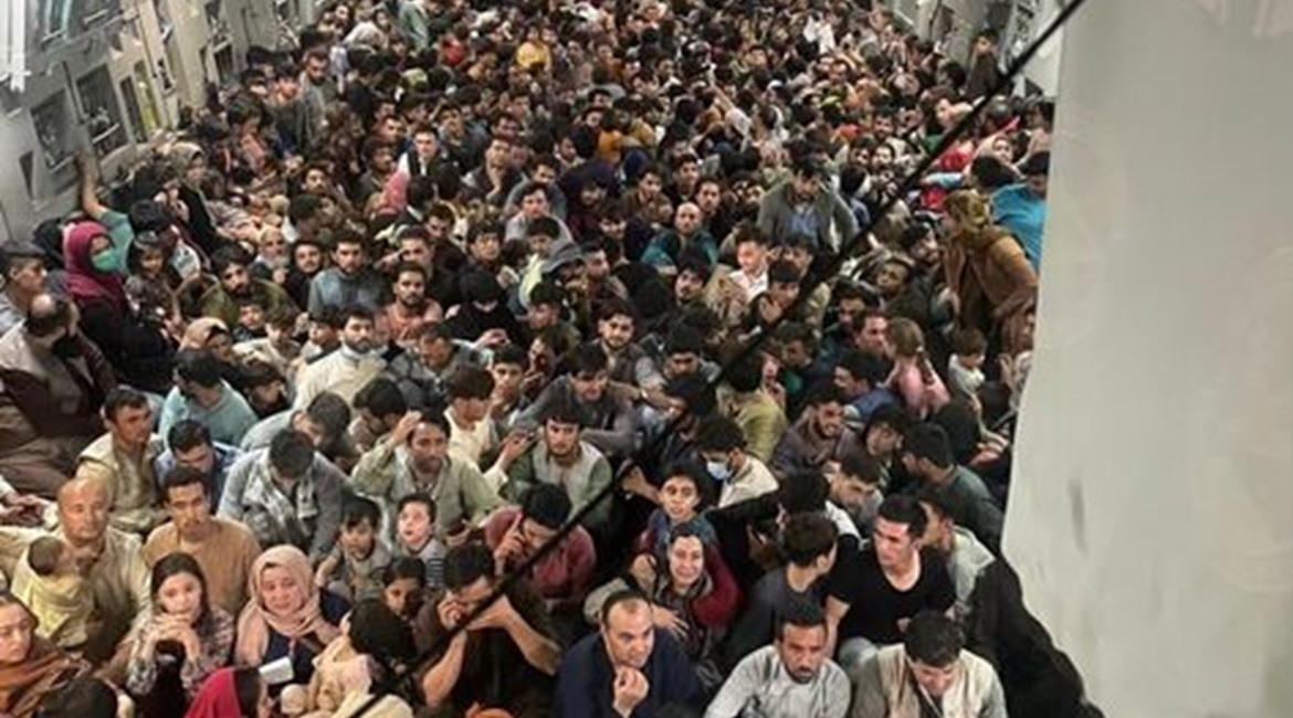 A US Air Force Boeing C-17 Globelaster III transports 823 Afghan citizens from Hamid Karzai International Airport in Kabul on 15 August. US Air Mobility Command said that this is a record for the C-17.