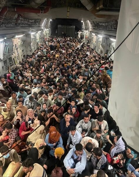 A US Air Force Boeing C-17 Globelaster III transports 823 Afghan citizens from Hamid Karzai International Airport in Kabul on 15 August. US Air Mobility Command said that this is a record for the C-17.