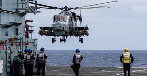 A Royal Navy Wildcat helicopter seen carrying a maximum loadout of 20 Martlet missiles during recent trials of the new weapons wing.