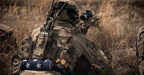 A US Army Ranger lies in the prone position, equipped with L3Harris's AN/PRC-163.