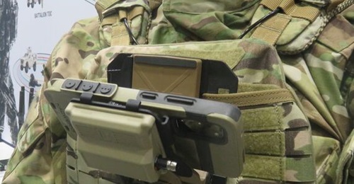 The Domo Tactical Communications SDR-M integrated into the Kägwerks DOCK-Lite chest mount. The cables emerging from the bottom are the antennas.