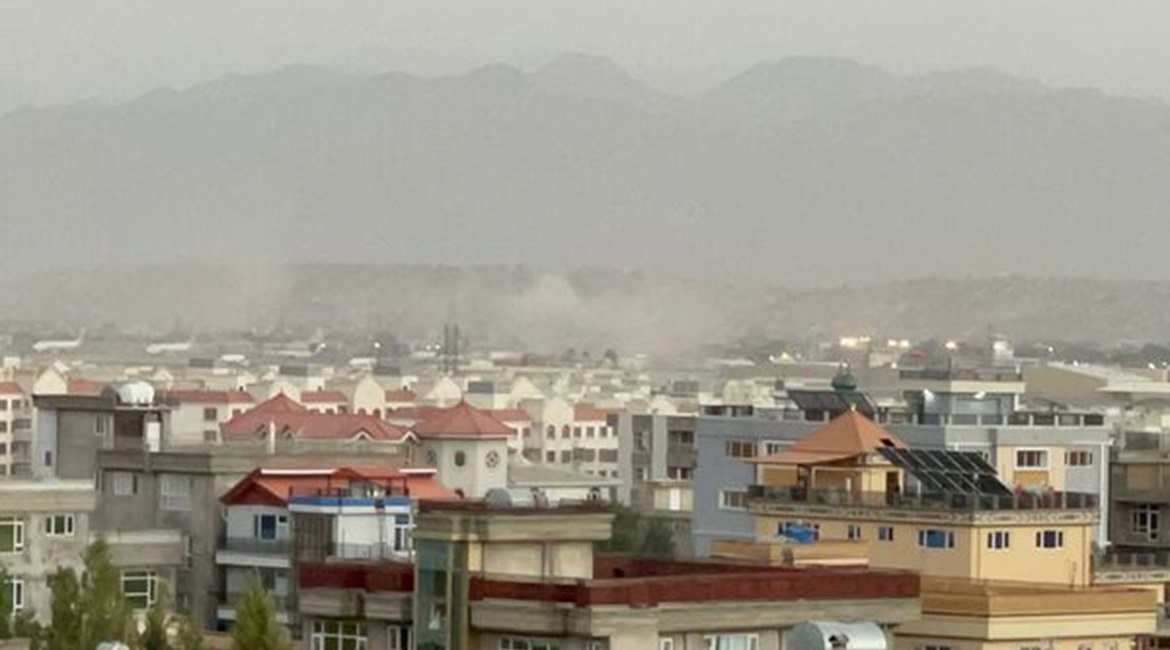Smoke rises in Kabul on 26 August following attacks by IS-K suicide bombers and gunmen outside Hamid Karzai International Airport, the centre of evacuation efforts from Afghanistan, that killed at least 72 civilians and 13 US military personnel.