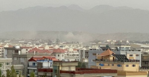 Smoke rises in Kabul on 26 August following attacks by IS-K suicide bombers and gunmen outside Hamid Karzai International Airport, the centre of evacuation efforts from Afghanistan, that killed at least 72 civilians and 13 US military personnel.
