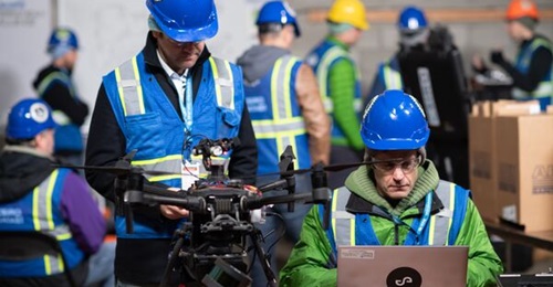 Team CSIRO Data61's DJI Matrice 210 UAV developed by Emesent in an undated image from DARPA's SubT Challenge urban circuit. The aircraft includes a Hovermap payload developed to include a light detection and ranging (LIDAR) sensor that helps the team m...