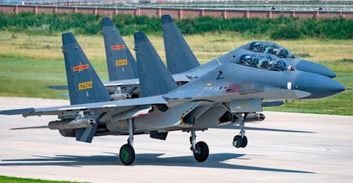 A file photo of PLAAF Sukhoi Su-30MKK 'Flanker' combat aircraft, a type that Chinese pilots may fly and fight following flight instructions from former RAF officers.
