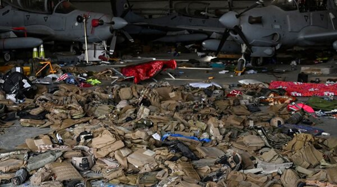 Sets of body armour along with several AAF A-29 light attack aircraft inside a hangar at Kabul airport on 31 August. The Pentagon said that before leaving Afghanistan, US troops disabled 73 aircraft at the airport, almost of all which had belonged to t...