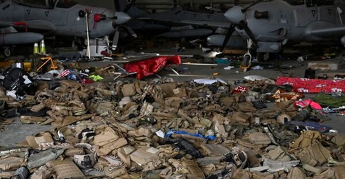 Sets of body armour along with several AAF A-29 light attack aircraft inside a hangar at Kabul airport on 31 August. The Pentagon said that before leaving Afghanistan, US troops disabled 73 aircraft at the airport, almost of all which had belonged to t...
