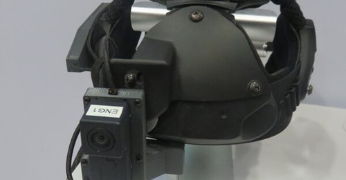 A prototype InterSense IS-1500 Scorpion HMD shown at AUSA 22. The InertiaCam is the labelled device mounted above the monocular display.