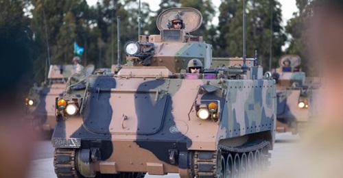 The Australian Army soldiers of the 7th Battalion, the Royal Australian Regiment, drive an M113AS4 armoured personnel carrier during the 9th Brigade transition to the ICB held in RAAF Base Edinburgh.