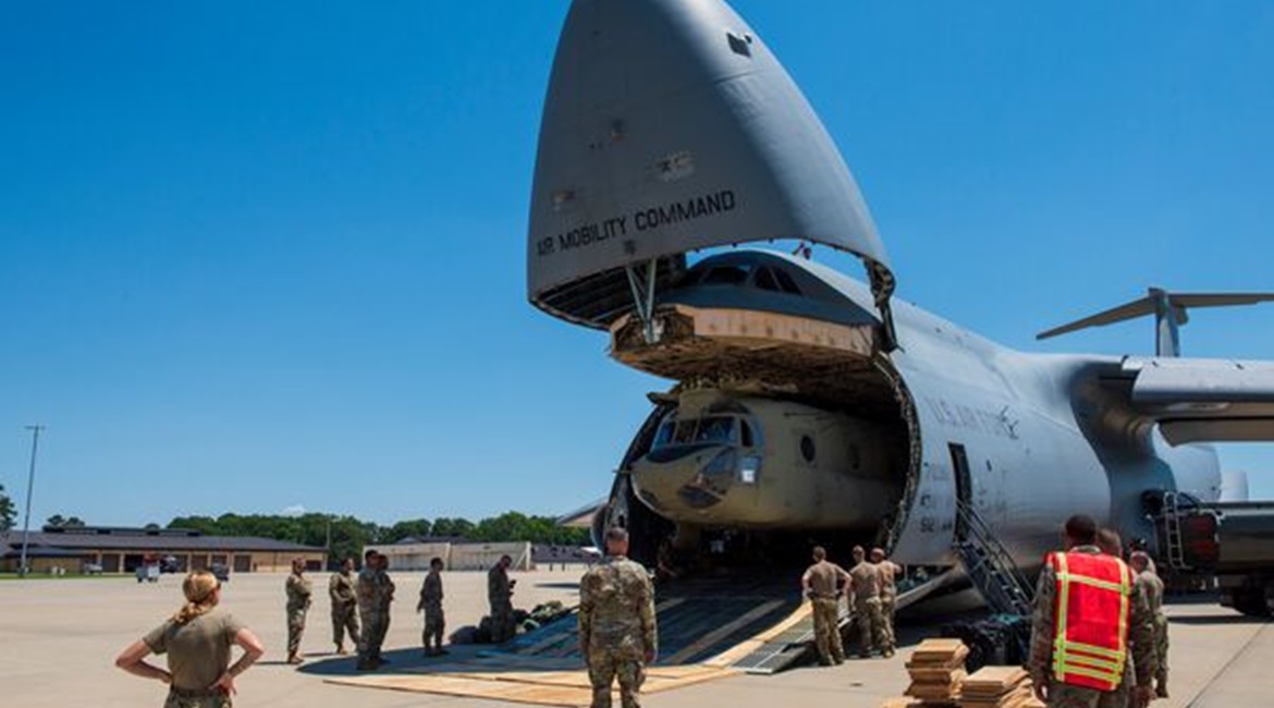 A Boeing CH-47F Chinook is removed from the cargo area of a Lockheed C-5M Galaxy at the Seymour Johnson Air Force Base in North Carolina on 18 June 2021. The USAF used C-17As and C-130s for its evacuation of Kabul instead of the C-5M, despite the Super...
