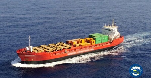 with armoured vehicles loaded on its deck.