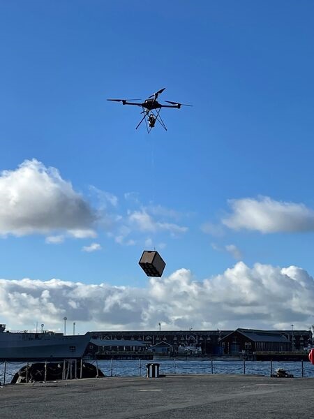 Sparrow (pictured), attached to a third-party UAV, which is lifting a 5 kg mock payload.