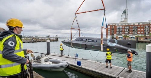 SubSea Craft's Victa-class DDU prototype being lowered into the water for the first time on 9 September 2021 outside the company's waterfront facility in Portsmouth, UK.