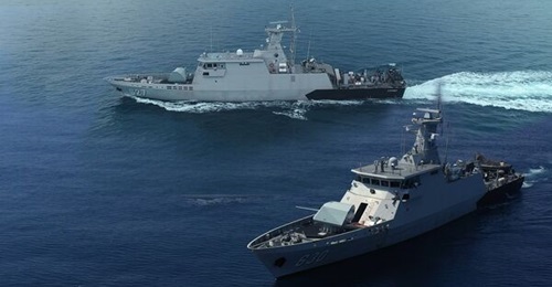 A composite image of KRI 
        
        and KRI 
        
        , conducting sea trials as part of a commodore inspection process.
