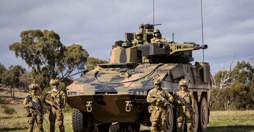 The German Army's heavy weapon carrier will be based on Austrialia's Boxer Combat Reconnaissance Vehicle, pictured with Australian Army soldiers during Exercise 'Chong Ju' at the Puckapunyal training area, Victoria, on 16 May 2018.