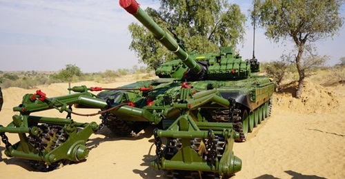 A T-72 MBT with trawl assembly, seen here from an Indian Army exercise at Rajasthan in November 2022, has a trawling speed of 4 km/h, tank alignment time of five minutes, and 1,000 m trawling time of 30 minutes. The weight of each roller set, frame, an...