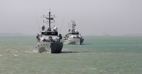 HMAS 
        
         and HMAS 
        
         sail in formation as they depart Darwin Harbour for the Patrol Boat Concentration Period.
