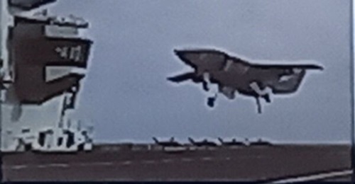 A low-resolution artist's impression of a Ghost Bat unmanned aircraft landing aboard a Queen Elizabeth-class aircraft carrier, as it appeared in a briefing slide being presented under the Chatham House Rule. Boeing, which designed the Ghost Bat, confir...