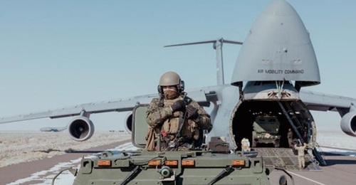 A US marine rides in an M142 High-Mobility Artillery Rocket System during joint Exercise 'Scarlet Dragon' in Dugway, Utah, on 2 February 2023.