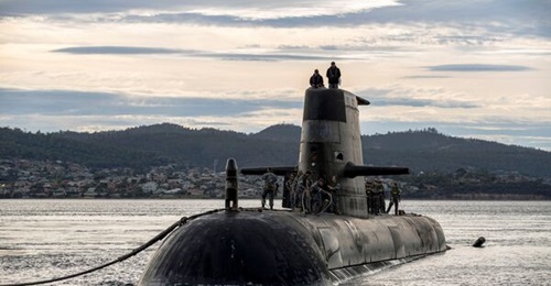 An Australian Collins-class submarine, HMAS 
        
        , arrives for a logistics port visit in Hobart. The class is expected to be retired closer to 2040, when Australia is expected to operate its nuclear-powered boats.