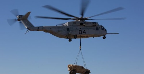 A CH-53K King Stallion lifts a Joint Light Tactical Vehicle during an exercise.