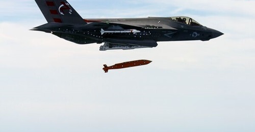 An F-35C Lightning II test aircraft conducts the first separation of an AGM-154C variant Joint Standoff Weapon from an F-35.