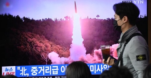 A televised footage of a North Korean Hwaseong-18 missile test, at a railway station in Seoul on 13 April 2023.
