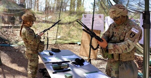 US Army soldiers with the 3rd Brigade Combat Team, 101st Airborne Division, conduct qualification exercises on AN/PRC 163 tactical radios at Fort Campbell, Kentucky, in March 2023.