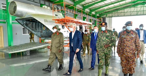 ProHeli CEO Valerii Copeichin shows President Museveni around the MRO facility at Nakasongola Air Base.
