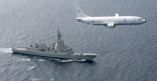 A RAAF P-8A Poseidon MPA works with the RAN guided-missile destroyer HMAS 
        
        . The maritime air power provided by the P-8A is integral to lacing together the RAN's capabilities and outputs.