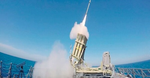 A still from a video released by the Israel Defense Forces on 18 May 2016 showing an Iron Dome launcher mounted on the helipad of a Sa'ar 5 corvette firing a Tamir missile. Rafael has since released a modular variant of the C-Dome, which is the naval v...