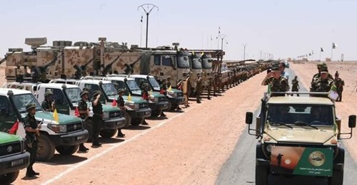 Chief of Staff General Saïd Chengriha inspects forces after an exercise, including trucks with the antennas associated with the CHL-906's multifunction radar jamming and ELINT stations.