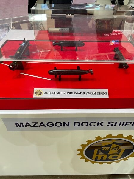 A model of Mazagon Dock's autonomous underwater vehicle swarm drones displayed at LIMA 2023.