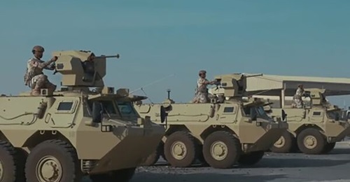 Military science students man the SARP weapon stations fitted to Qatar's upgraded VAB armoured personnel carriers during Exercise 'Lebsair'.