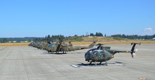 The Japan Ground Self-Defense Force's fleet of Bell AH-1S Huey Cobras is scheduled to be replaced by unmanned combat aerial vehicles by 2027. This photo of JGSDF AH-1Ss and a Hughes OH-6 Cayuse light observation helicopter was taken in 2014 in the Unit...