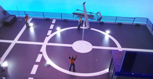 A diorama of ship crew operating a VTOL UAV from the flight deck of a corvette on display at IAI's booth in MADEX 2023. The company is developing a new type of radar that can be fitted onboard VTOL UAVs.