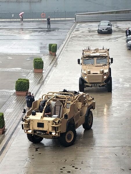 A HED-equipped Jackal 2 high-mobility patrol vehicle and Foxhound protected patrol vehicle demonstrating silent running outside the ExCel Centre at DSEI 2021.